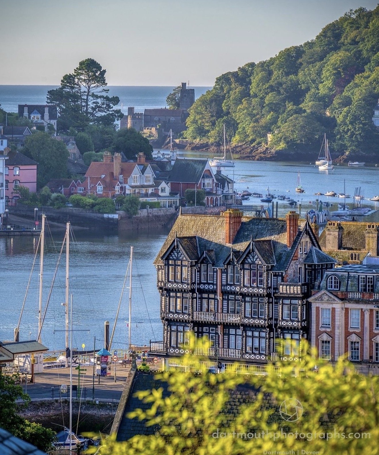 Aerial view of Dartmouth harbour with boats and River Dart estuary at dusk