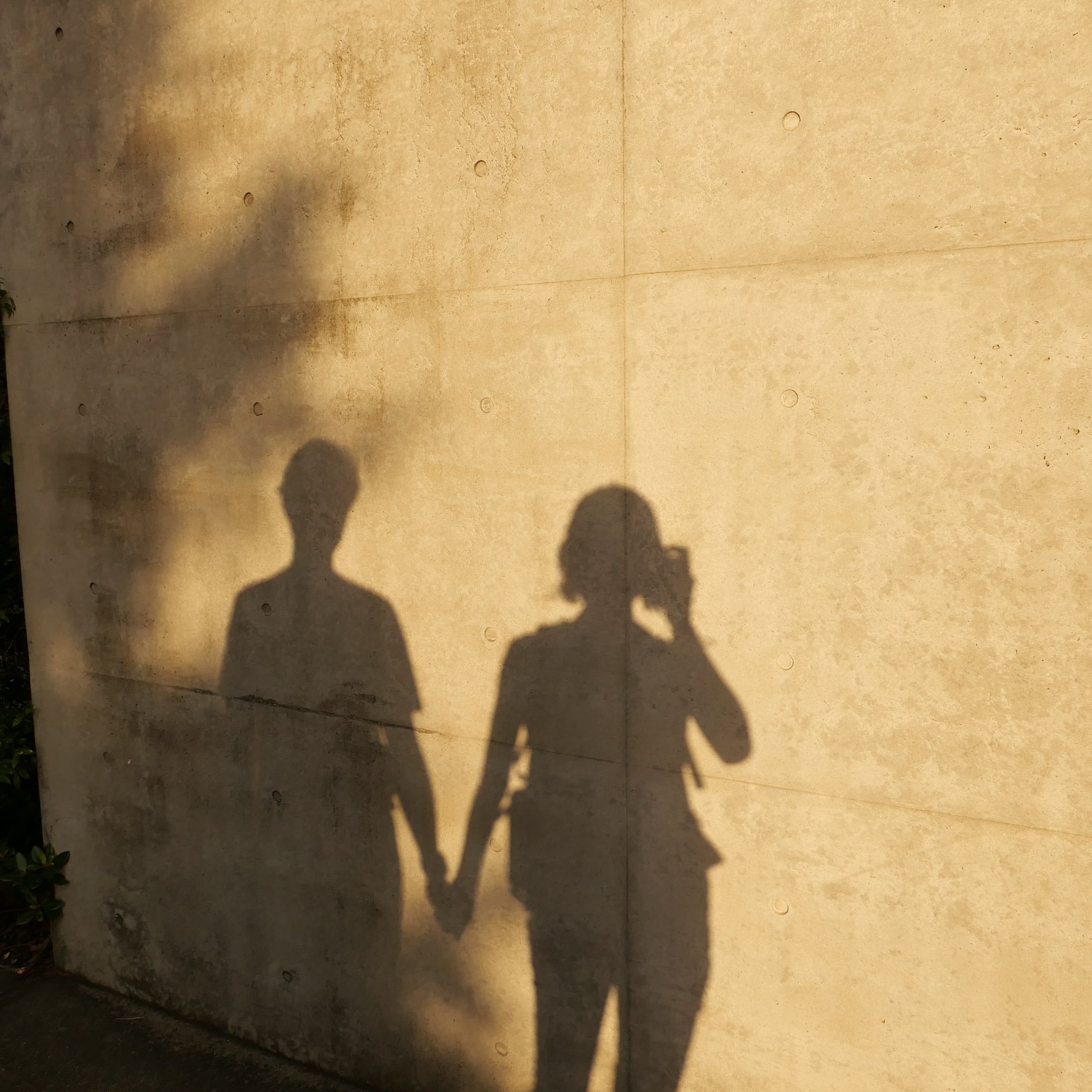 Silhouette of couple on the beach at sunrise